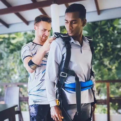 skydiving instructor gearing up passenger in sri lanka